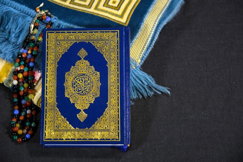 Quran with colourful prayer beads