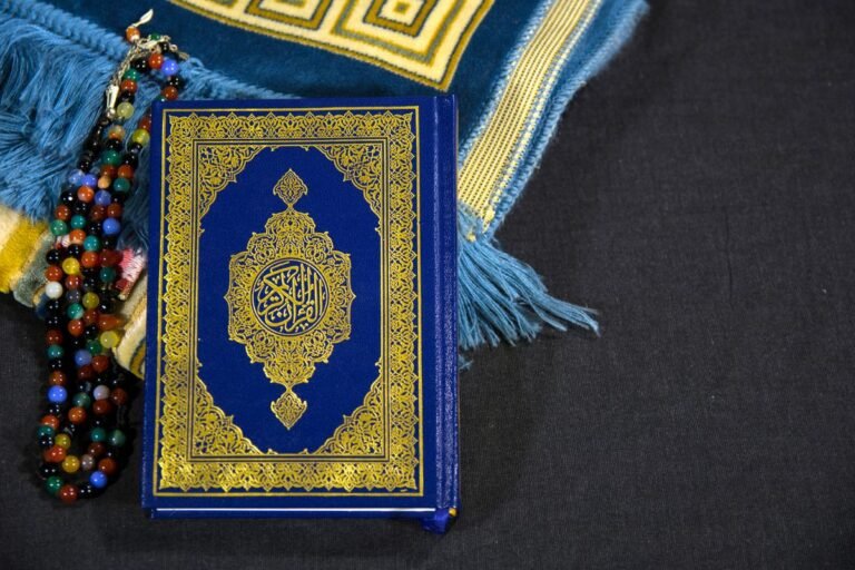 Quran with colourful prayer beads
