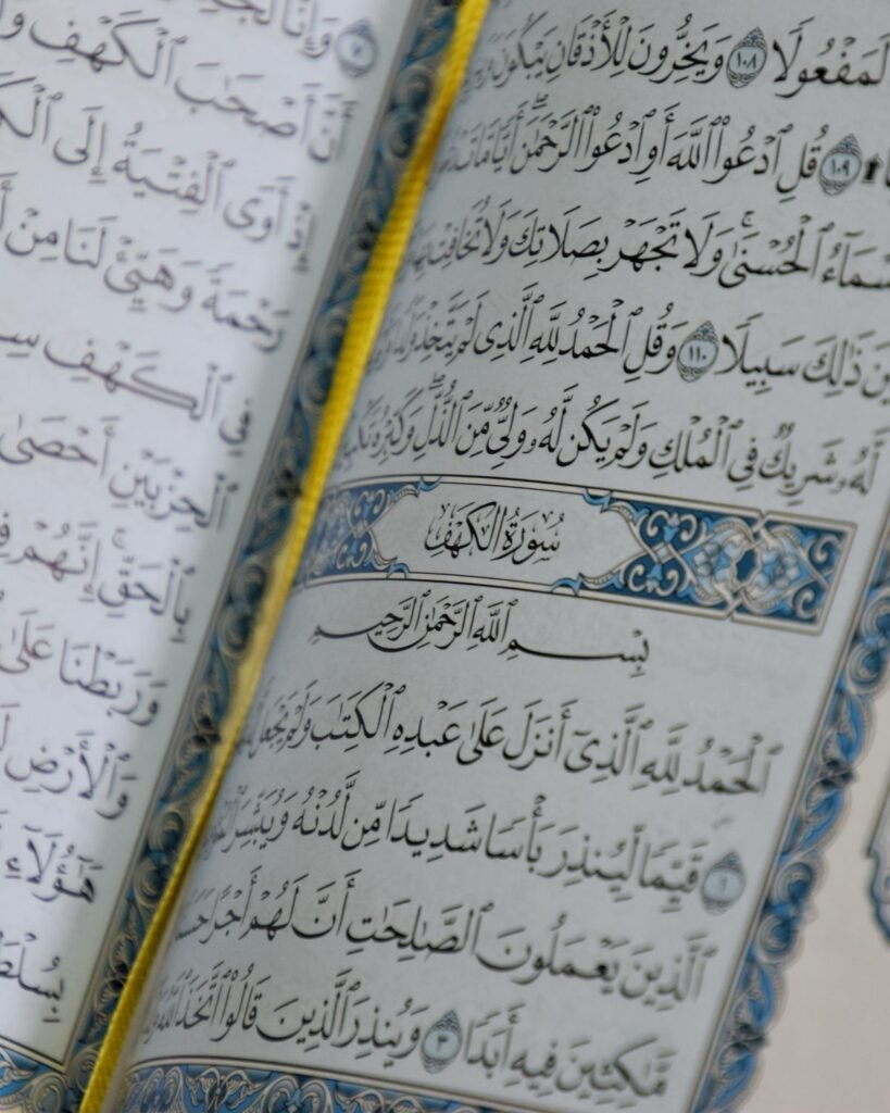 Close-up of open Quran pages with Tajweed